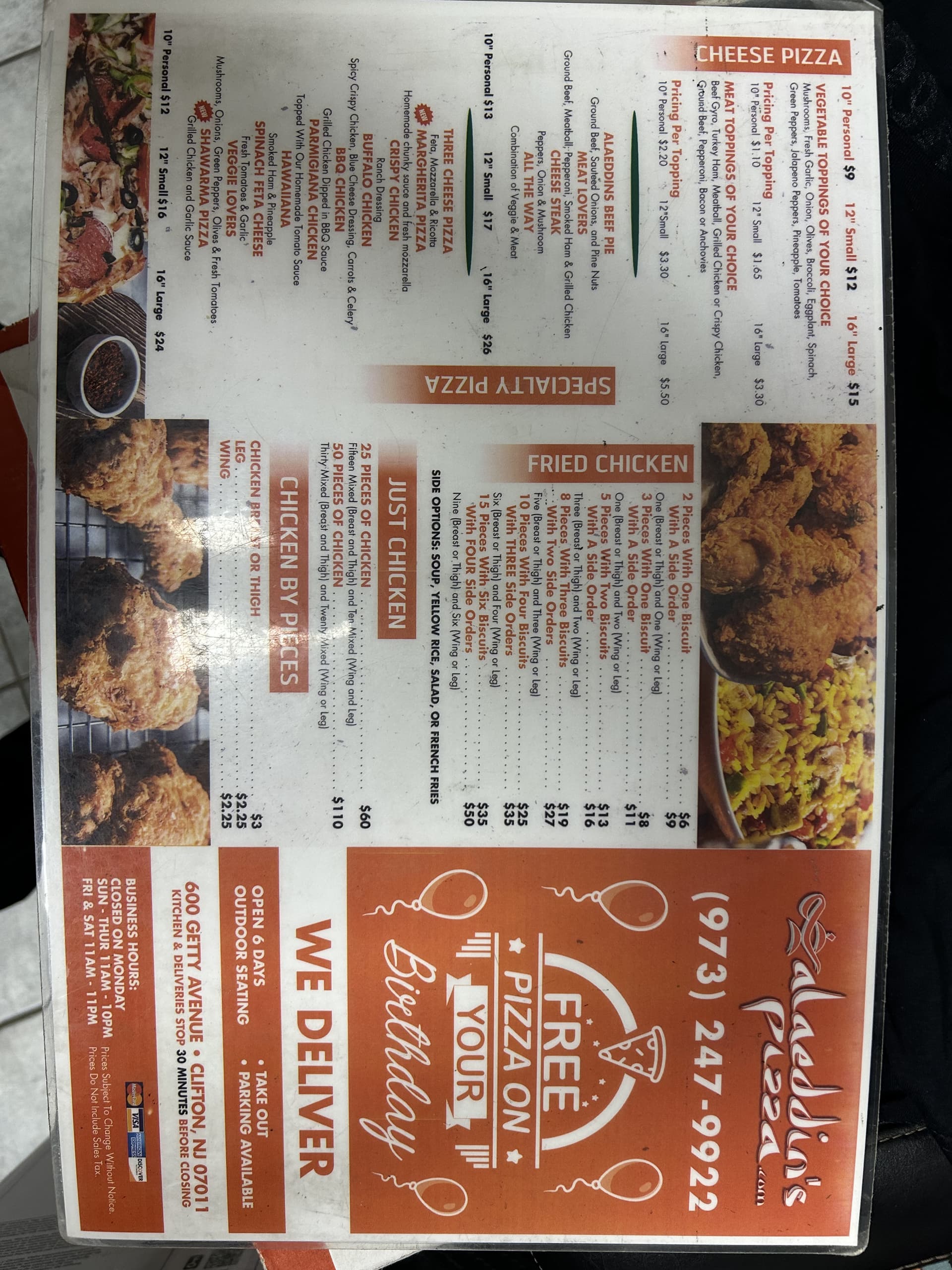 Alaeddin's Pizza menu board — halal fried chicken, wings, subs and salads